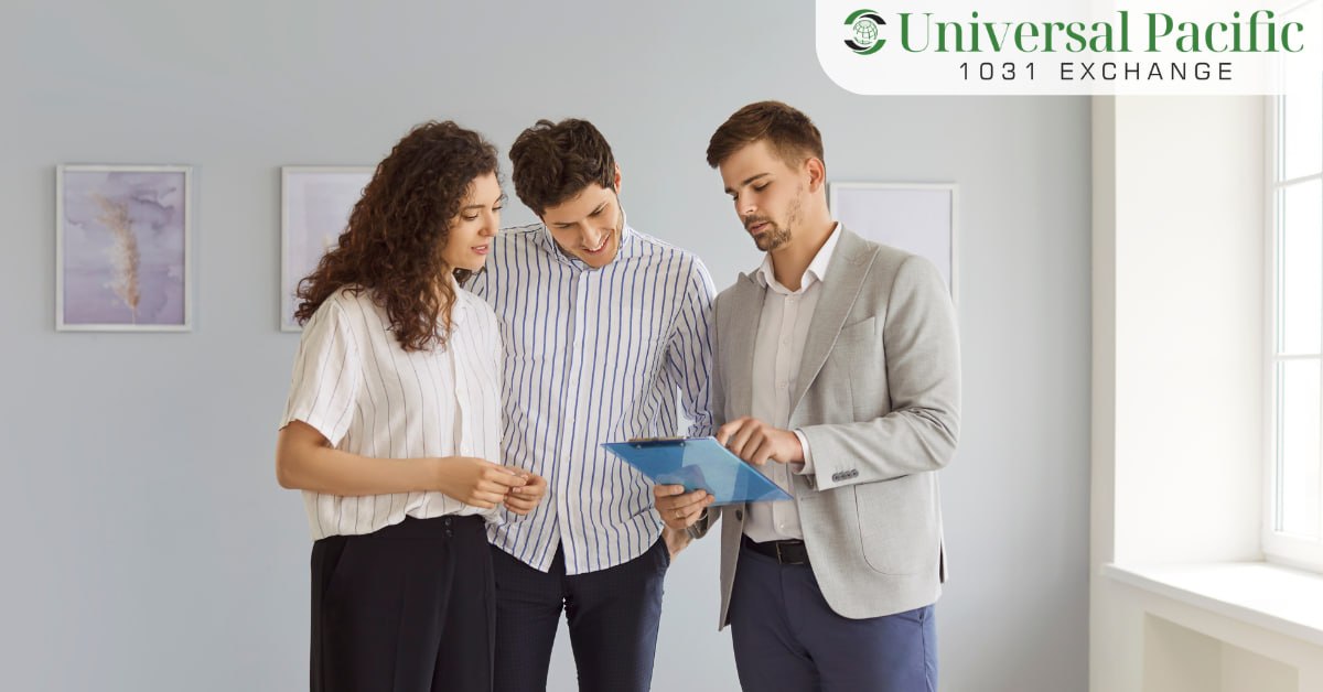 Two investors reviewing documents with a real estate advisor inside a property