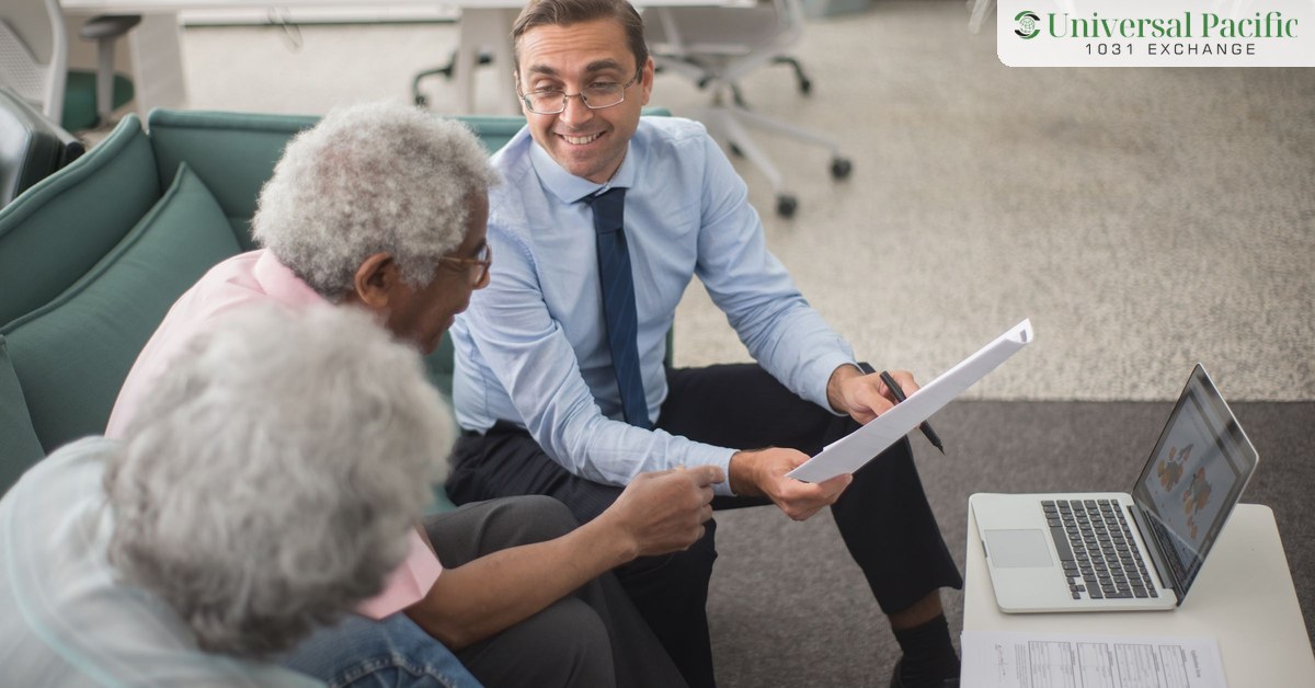 Advisor discussing 1031 exchange alternatives with clients across a desk